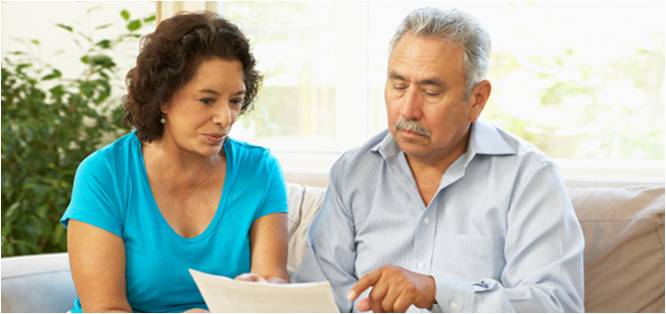 Older couple reading a document together